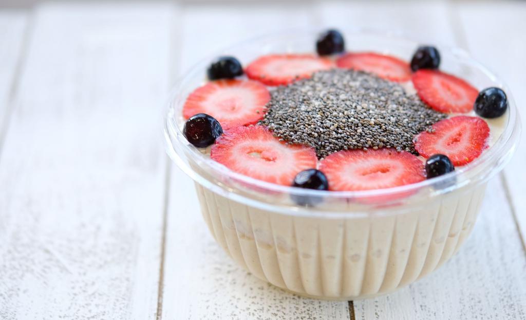 Cashew Cheesecake · Banana, date, cashews, coconut oil, lemon wedge and cinnamon. Garnished with blueberries, strawberries and chia seeds.