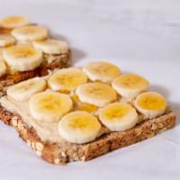 Cashew Butter Toast · 2 slices of sprouted grain bread topped with organic cashews butter, sliced bananas and honey.