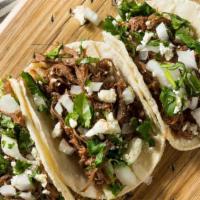 Tacos · 3 tacos made with flour tortilla filled with your choice of meat , served with spanish rice ...