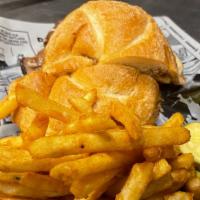 Hot Roast Beef Sandwich · Served on a fresh kaiser roll with au-jus. Served with chips.