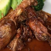 Crispy Tamarind Duck · Crispy half duck with sweet tangy tamarind sauce, fried shallot, steamed vegetable