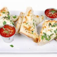 Garlic Bread · Half of a loaf of Italian bread baked with garlic, mozzarella cheese and olive oil.