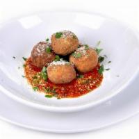 Risotto Balls · Stuffed with Prosciutto di Parma, peas & mozzarella, served with San Marzano marinara, parmi...