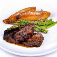 Grilled Steak Tips · marinated certified angus beef tips, potato wedges, grilled asparagus, bourbon glaze