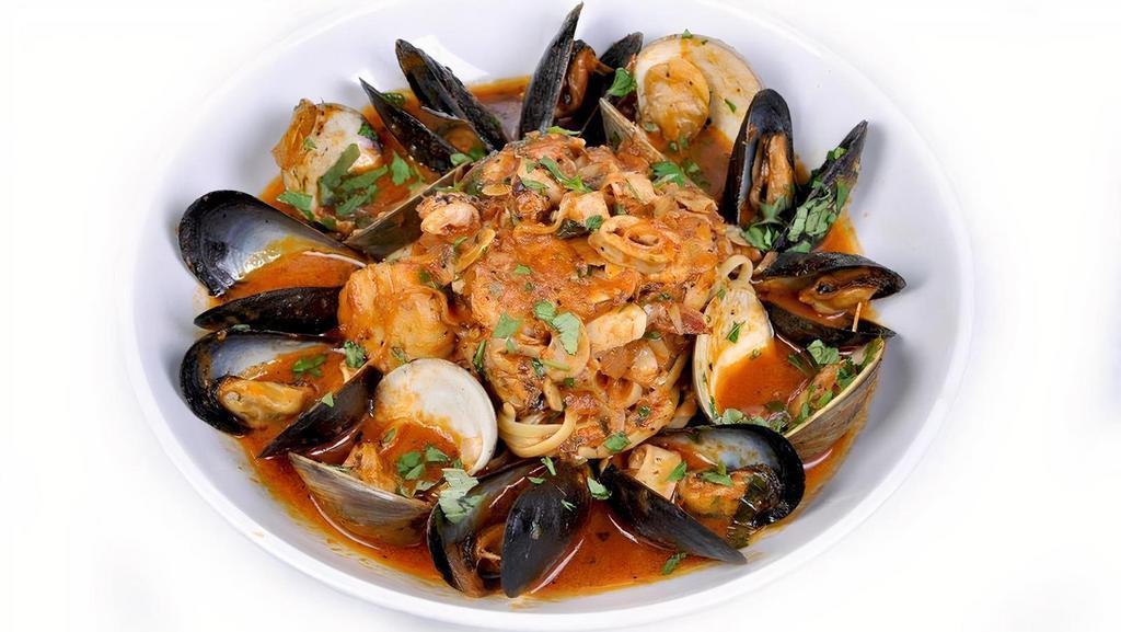 Frutti Di Mare · Pan seared scallop, shrimp, braised littlenecks, P.E.I. mussels, calamari, spicy San Marzano marinara sauce, natural sea broth, linguini pasta
