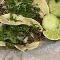Mexican Tacos · Homemade Corn Tortillas, Your Favorite Meat, topped with Onions and Cilantro served with sal...