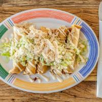 Flautas · Deep fried Taquitos topped with lettuce, Crema Fresca and Queso Fresco.