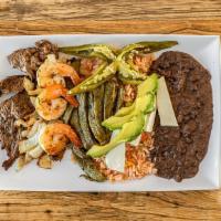 Carne Asada · Beef Steak, shrimp, onions, & grilled cactus leaf, served with Mexican rice, refried beans, ...