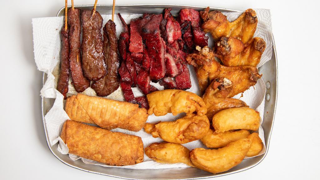 Pu Pu Platter One Small · 1 egg roll, 2 spare ribs, 2 chicken wings, 2 fried shrimps and 2 chicken teriyaki.