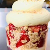 *New* Strawberry Blonde · Strawberry cheesecake ice cream with a red velvet core, topped with fresh strawberries, grah...