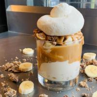Pb & B · Vanilla ice cream topped with fresh bananas, reeses cups, peanut butter sauce and homemade w...