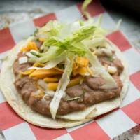 Bean Taco · Most popular. With vegetarian or refried pinto beans, onions, cilantro, pico de gallo, and c...