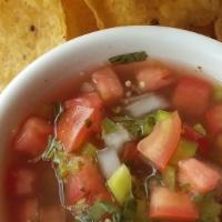 Salsa & Chips · Vegetarian, Gluten Free. Choice of red or green salsa. Served with chips.