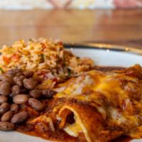 Enchilada Dinner · Gluten Free. Classic Chicken Enchiladas with Ancho Chile Sauce Spanish rice and pinto beans.
