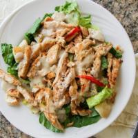 Grilled Chicken Caesar Salad · Romaine lettuce,, shredded parmesan cheese, roasted peppers, homemade croutons and tender ch...