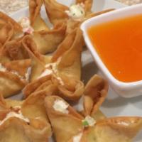 Crab Rangoons · Fried wonton wrapper filled with crab and cream cheese.