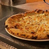 Quattro Impertore · Four cheese pizza: mozzarella, pecorino Romano, gorgonzola and goat cheese.
