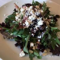 Di Casa · Field greens, roasted beets, roasted pistachio, crumbled goat cheese, shallots and lite rasp...