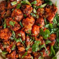 Gobi Manchurian (V) · Vegan. Dry. Cauliflower fritter cooked with ginger, garlic, onions, and with a touch of soya...