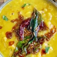 Dal Tadka (V) · Vegan, gluten free. Yellow lentil tempered with Indian spices and tomatoes, Indian herbs and...