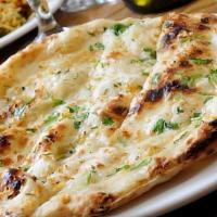 Garlic Chilly Naan (V) · Spicy. Made with all-purpose white flour. White flour bread with garlic and chilly baked in ...
