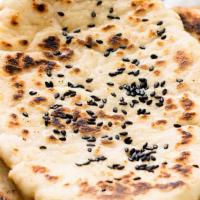 Sesame Naan (V) · Made with all-purpose white flour. White flour bread baked in tandoor topped with sesame see...