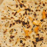 Onion Kulcha (V) · Made with all-purpose white flour. Naan bread filled with lightly spiced onions.