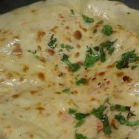 Aloo Kulcha (V) · Made with all-purpose white flour. Naan bread filled with mildly spiced tomatoes.