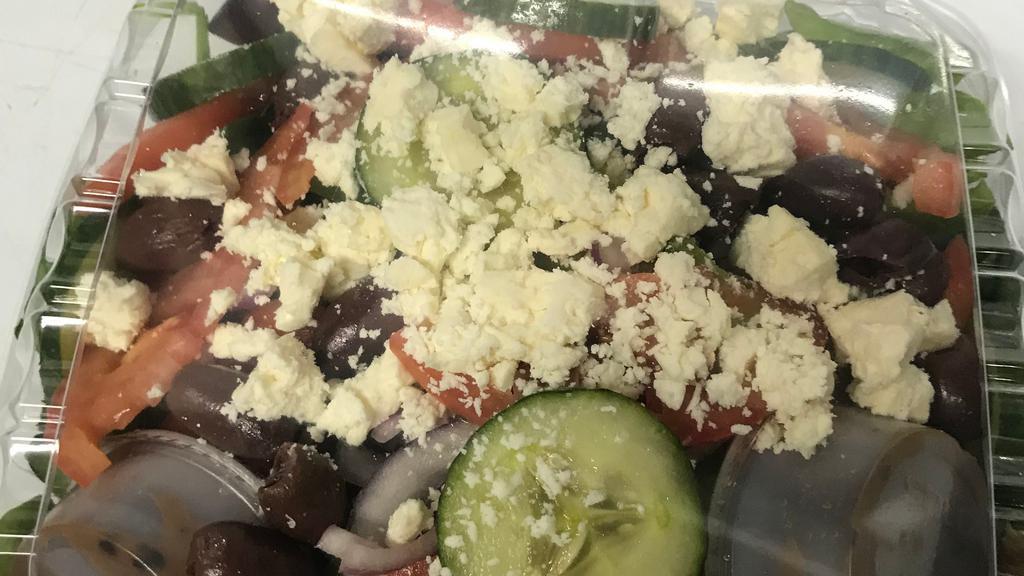 Greek Salad · Romaine lettuce, tomatoes, onions, cucumbers, pepperoncinis, kalamata olives, feta cheese & stuffed grape leaves with balsamic vinaigrette dressing.