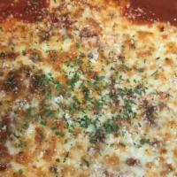 Lasagna · Layers of pasta with home-made marinara sauce, sautéed ground beef, mozzarella and ricotta c...