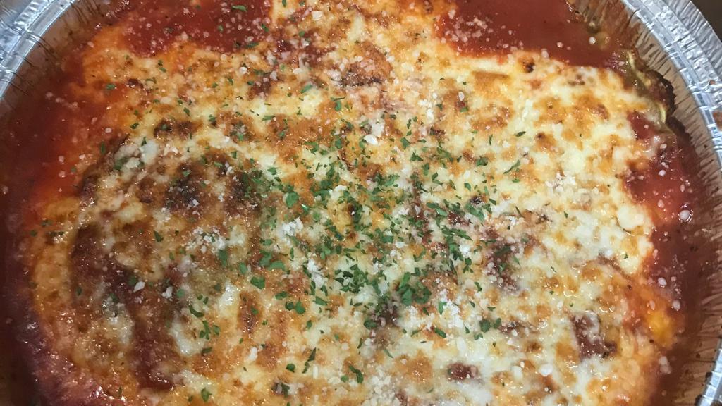 Lasagna · Layers of pasta with home-made marinara sauce, sautéed ground beef, mozzarella and ricotta cheeses.