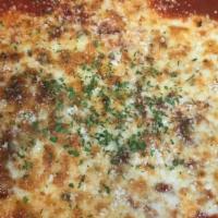 Cheese Manicotti · Pasta stuffed with ricotta and mozzarella cheeses, baked in marinara sauce and topped with m...