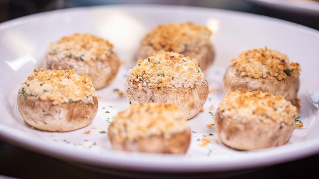 Stuffed Mushrooms · Fresh mushroom caps stuffed with a blend of cream cheese and Italian herbs topped with panko breadcrumbs and Parmesan cheese.