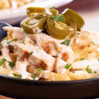 Chicken Alfredo Fries · It's our signature dish, except on French fries! We start with golden fries, then layer on t...