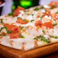 Chicken Spinach Pesto · This crispy flatbread is topped with melted mozzarella, sliced grilled chicken, diced Roma t...
