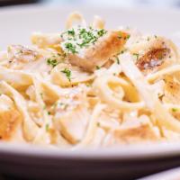 Chicken Fettuccine Alfredo ⭐️ · Tender slices of grilled chicken and fettuccine pasta tossed in our creamy, made-fresh-daily...