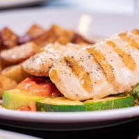 Tuscan Herb Chicken · A grilled chicken breast sautéed with a savory mix of yellow squash, zucchini, tomatoes, min...
