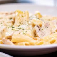 Pollo Affumicato · A juicy sliced grilled chicken breast sautéed with ham and mushrooms and tossed with ziti an...