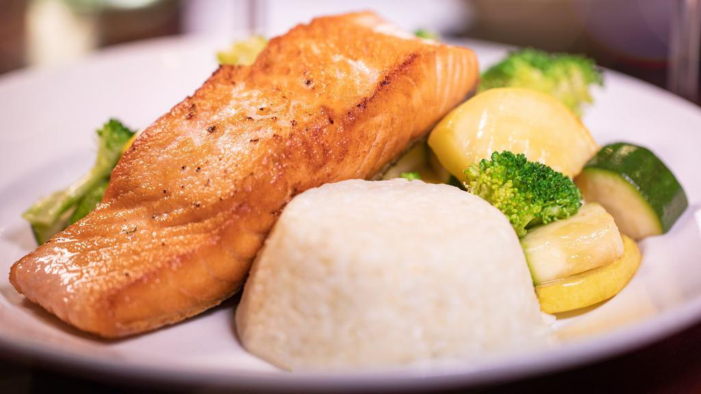 Grilled Salmon · A fresh, never-frozen grilled salmon filet served with your choice of one side and a soup or salad