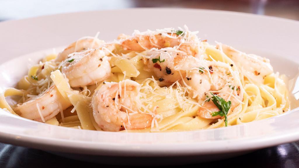 Shrimp Diavolo · A simple, traditional Italian dish of shrimp sautéed in a white wine sauce, then tossed with our blend of Italian herbs and spices and served with fettuccine.
