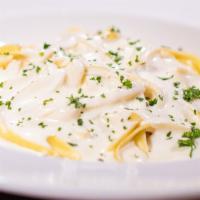 Fettuccine Alfredo ⭐️ · A simple, classic dish of fettuccine tossed in our signature, made-fresh-daily Alfredo sauce.
