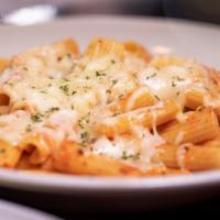 Baked Pasta · Your choice of ziti or spaghetti tossed in our signature marinara herb sauce, topped with mo...