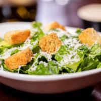 Caesar Salad W/ Salmon · A fresh, never frozen salmon filet tops fresh Romaine lettuce accented with crunchy croûtons...