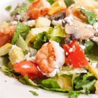 Mediterranean Salad · Shrimp, mushrooms, yellow squash, and zucchini sautéed in a white wine sauce. Served on a be...