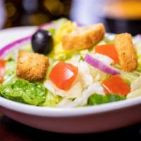 Side Salad · Fresh Romaine and iceberg lettuce, tomatoes, red onion, black olives, and croûtons.