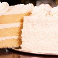 Coconut Rum Cake · Three layers of light, moist, fluffy yellow cake enhanced with the tropical flavors of real ...
