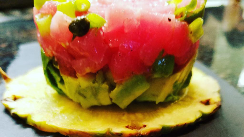 Tuna Tartar · Yellowfin tuna tartar, avocado, caper, red onion, lemon, olive tapenade