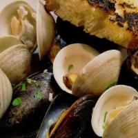 Mussels & Clams · P.E.I mussels, littleneck clams, thyme, with a spicy tomato broth or white wine garlic sauce.