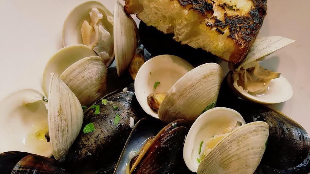Mussels & Clams · P.E.I mussels, littleneck clams, thyme, with a spicy tomato broth or white wine garlic sauce.