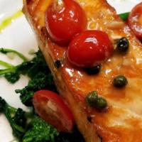 Grilled Salmon · Served with sautéed spinach, cherry tomatoes, garlic in a lemon caper sauce.